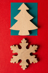 wooden christmas tree and snowflake on paper