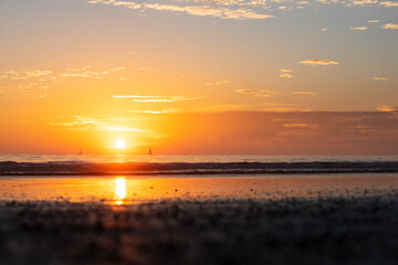 Sunset in the sea with beautiful clouds. Sunrise ocean seascape.