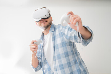 man wearing Virtual Reality VR Headset. VR for gaming. Man play game in VR glasses.