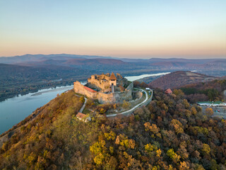 Hungary - The historical Visegrad Castle near Danube river from drone view at sunset