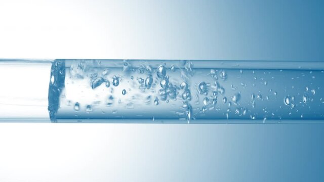 Transparent liquid flows in glass tube creating transparent different sized bubbles with on pale blue background | Abstract face care cosmetics formulating concept