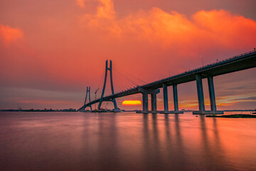 Sunset at Vam Cong bridge on the Mekong river