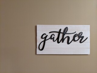 Rustic Sign With The Word Gather Inscribed In Cursive Writing, Great For Background