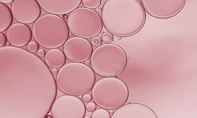 Oil bubble on rose pink background.