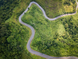 Aerial view of steep curve road in Northern region of Thailand. Northern Thailand's beautiful, rugged geography is the region's great temptation.