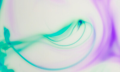 Beautiful  background of swirls with an abstract pattern of bubbles created by a mixture of paint colours in a milk base.