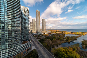 Elevated winter panorama of South Etobicoke condominium towers, residential neighborhoods, and Lake Ontario under a clear blue sky with clear visibility across the western Toronto urban area © contentzilla
