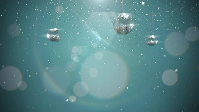 Silver balls and fly snowflakes with bokeh, motion holidays and winter style background for New Year and Merry Christmas