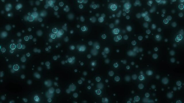 A blurry image of many bluish air bubbles against a black background. Nice calming background.