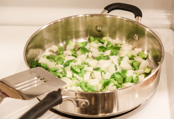 Saute' green peppers and onions 