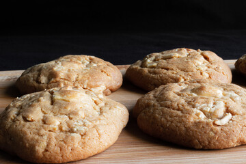 White chocolate cookies on a wooden table