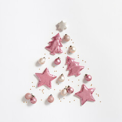 Christmas tree from christmas glitter toys, minimal New Year composition pink color, monochrome image. New Year holiday layout