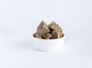 halva from sunflower seeds on a white plate. national traditional sweetness of turkish halva on the table. High quality photo