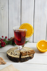 Glass with mulled wine and spices
