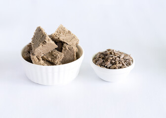 halva from sunflower seeds on a white plate. national traditional sweetness of turkish halva on the table. High quality photo