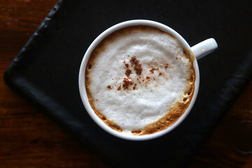cup of hot cappuccino coffee