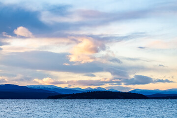 Stunning landscape sunset above mountains in wilderness of Yukon Territory, northern Canada.