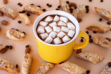 Cup with black coffee with marshmallows and cookies cantuccini, decorated almond and coffee beans...