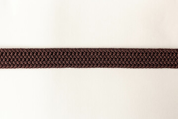 on a white background texture fabric woven brown strap