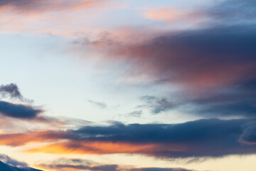Dark clouds with hints of pink, purple and orange tones great for editing or sky replacement filters photography resources. 