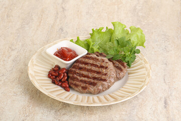 Grilled beef burger cutlet with sauce