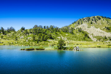 Little island over the Lac de Bastan, Saint Lary Soulan
