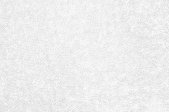 The texture of white towels for backgrounds, fabrics or textiles is made up of cotton fiber material that looks fluffy, dry, soft and clean.