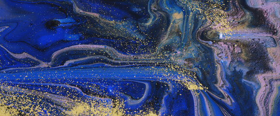 art photography of abstract marbleized effect background with black, gold and blue creative colors. Beautiful paint.