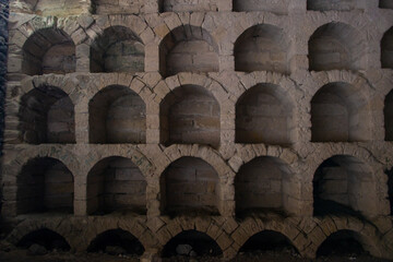 Niches for storing wine bottles.