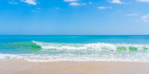 Blue-green wave on ocean beach in Florida in spring. Panoramic photo