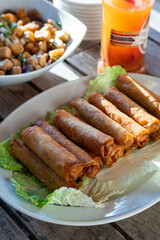 fried lumpiang togue is a common dish in the Philippines that consist of bean sprout, onion, carrots and cabbage wrapped in rice wrappers 