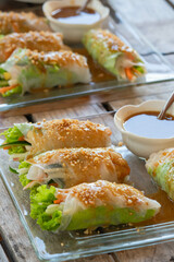 lumpiang ubod is appetizer food made from strips of palm heart lettuce, sauteed with shrimp and pork, rolled in rice wrapper and served with homemade peanut sauce