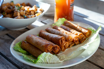 fried lumpiang togue is a common dish in the Philippines that consist of bean sprout, onion, carrots and cabbage wrapped in rice wrappers 