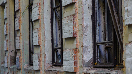 old abandoned premises, ruin. empty territories, abandoned houses. concept of war, Chernobyl disaster, apocalypse. brick buildings. sad view, heavy atmosphere, old broken windows