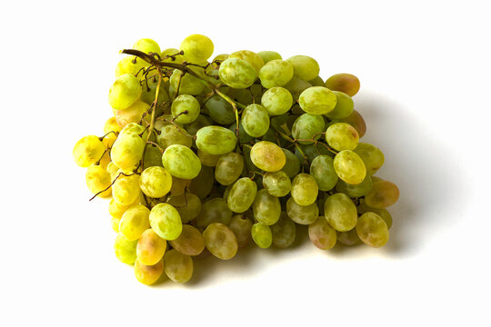 a brush of table white grapes on a white background