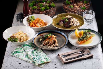 Set of different gourmet mediterranean dishes on the table