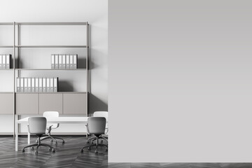 Light grey meeting room with blank wall