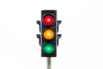 Isolated traffic light showing an illuminated red, amber and, green light.  Concept image...