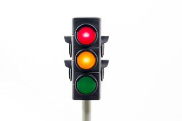 Isolated traffic light showing an illuminated red and amber light.  Concept image illustrating control of the COVID pandemic and movement between levels.

