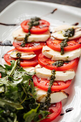 Closeup on italian caprese salad with mozzarella and tomatoes