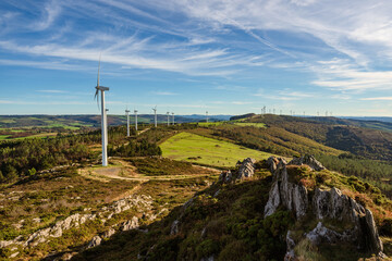 Fototapeta na wymiar Wind farm on top of mountains. Sustainable energy
