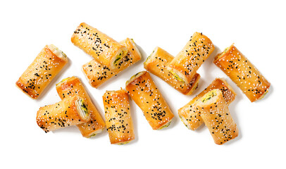 Turkish borek rolls with spinach and cheese. A traditional Turkish pastry rulo borek with black and white sesame seeds. Isolated on white background. top view