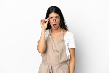 Fototapeta premium Restaurant waiter over isolated white background with glasses and surprised