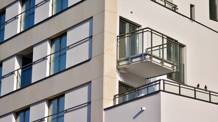 Modern apartment building in sunny day. Exterior, residential house facade. - obrazy, fototapety, plakaty