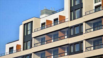 Modern apartment building in sunny day. Exterior, residential house facade.