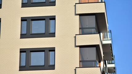 Modern apartment building in sunny day. Exterior, residential house facade.