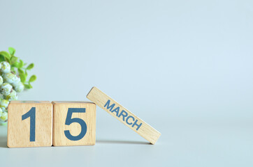 March 15, Calendar cover design with number cube with green fruit on blue background.