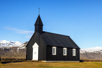 Fototapeta premium This 19th century Black Church is one of the oldest wooden churches of Iceland. Budir, Snaefellsnes peninsula.