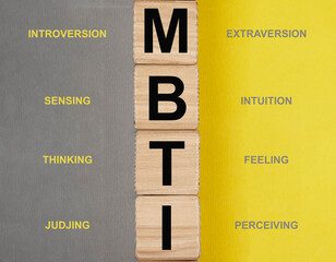 MBTI test and its types, dichotomies concept. Acronym on cubes.