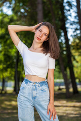 Young beautiful brown-haired girl with freckles on her face